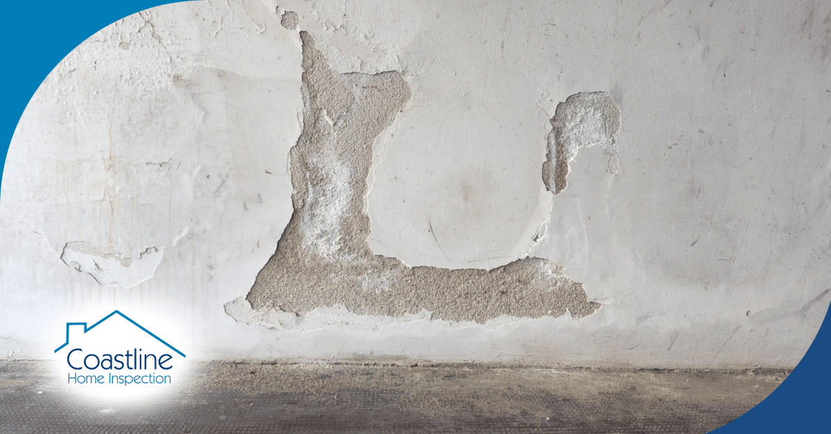 Water damage causing peeling and cracking on the wall.